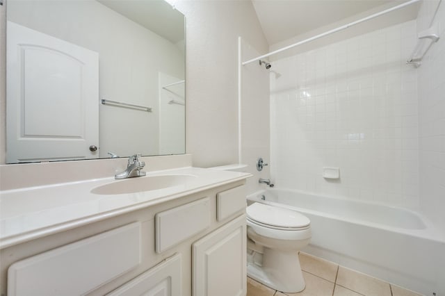 full bathroom featuring tub / shower combination, tile patterned floors, toilet, vanity, and lofted ceiling