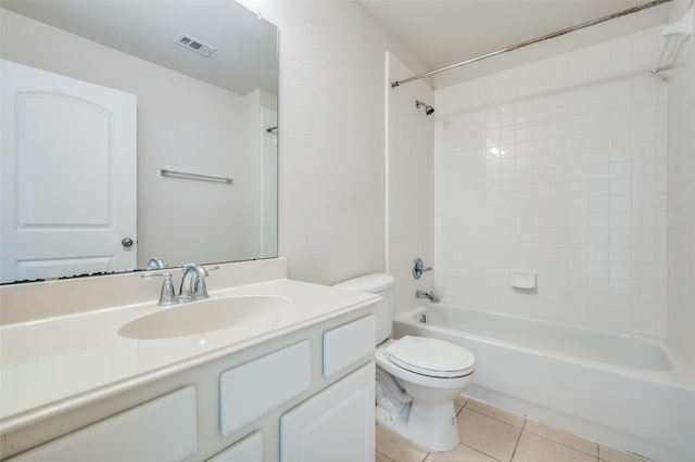 full bathroom with shower / tub combination, tile patterned floors, vanity, and toilet