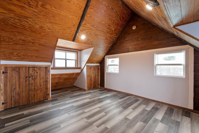 additional living space featuring lofted ceiling, wood ceiling, and wood-type flooring