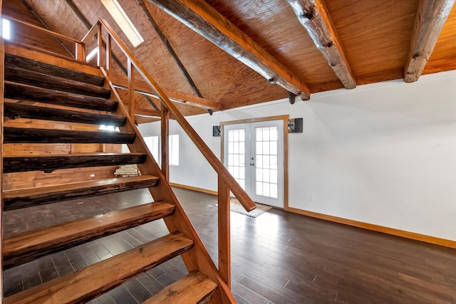 stairway with lofted ceiling with beams, wood-type flooring, wood ceiling, and french doors