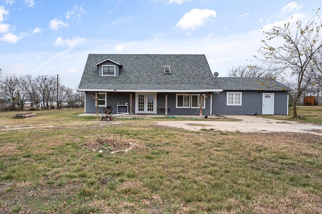 view of front of property with a patio and a front yard