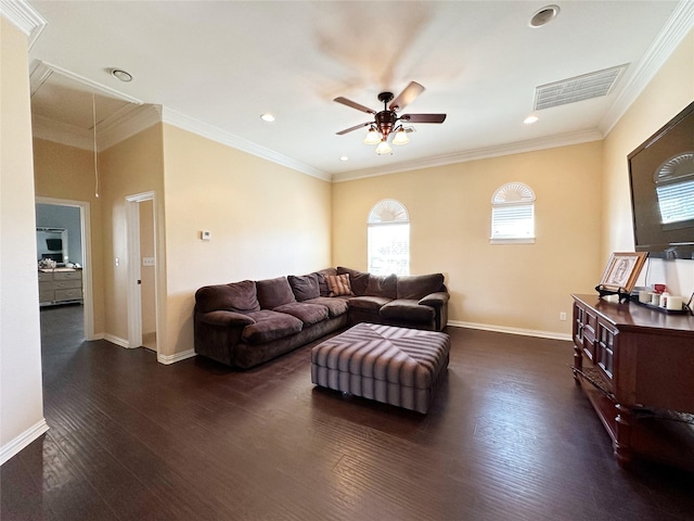 living room featuring ceiling fan, dark wood-type flooring, and ornamental molding