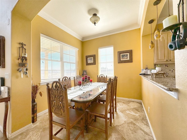 dining space with ornamental molding