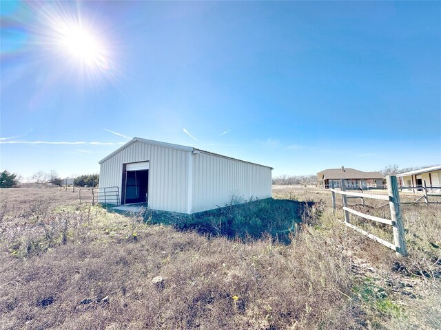 view of outdoor structure featuring a rural view