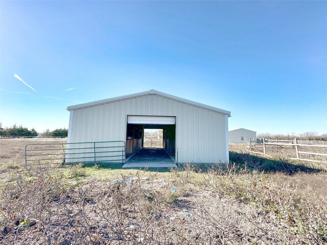 view of outbuilding with a rural view