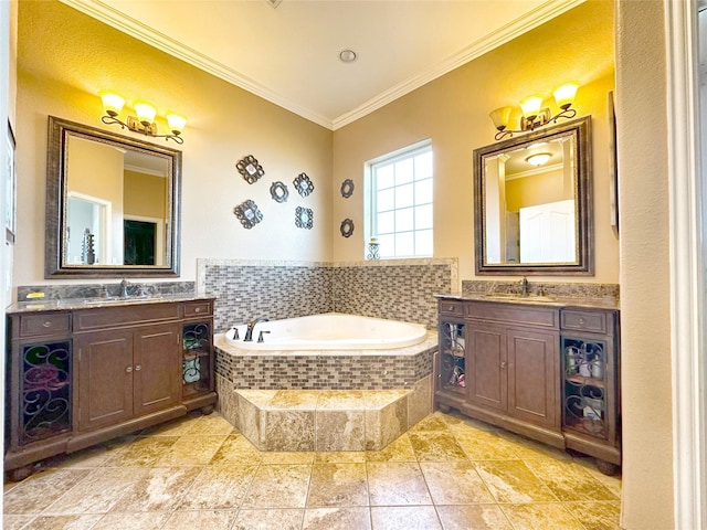 bathroom with tiled tub, crown molding, and vanity