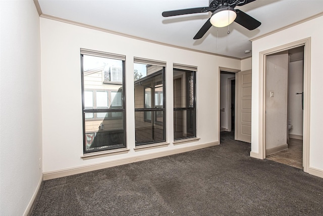 carpeted empty room with crown molding and ceiling fan