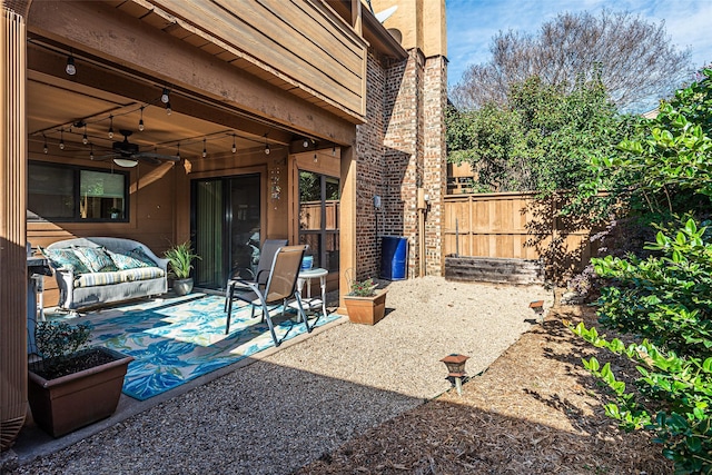 view of patio / terrace featuring ceiling fan