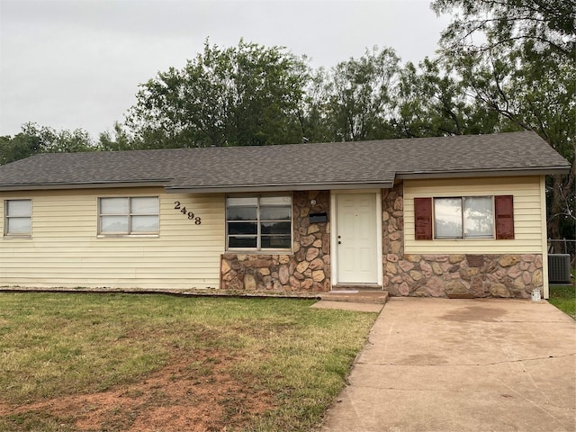 ranch-style home with a front lawn