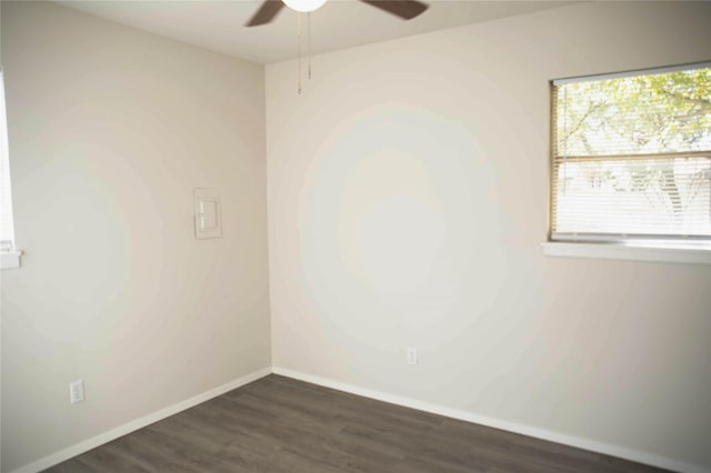 empty room featuring dark hardwood / wood-style floors and ceiling fan