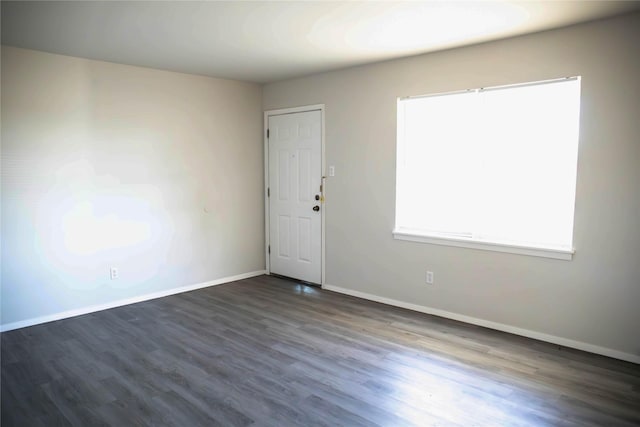 empty room featuring dark hardwood / wood-style floors