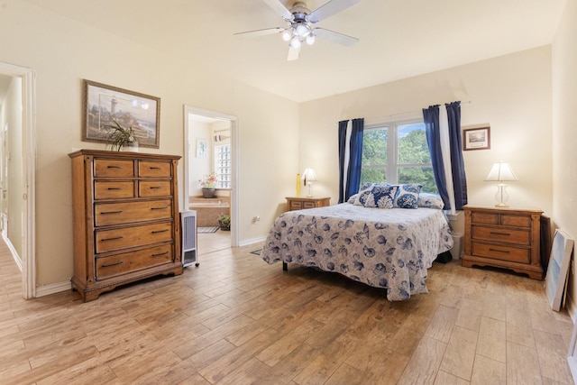 bedroom with ceiling fan, connected bathroom, and light hardwood / wood-style flooring