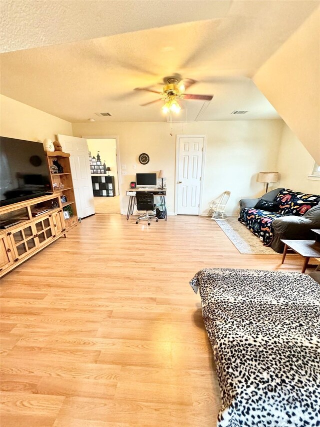 miscellaneous room featuring light hardwood / wood-style flooring and ceiling fan