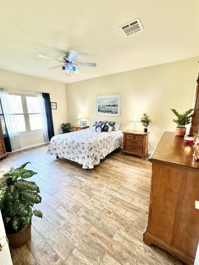 laundry room featuring cabinets, washer and clothes dryer, and light tile patterned flooring