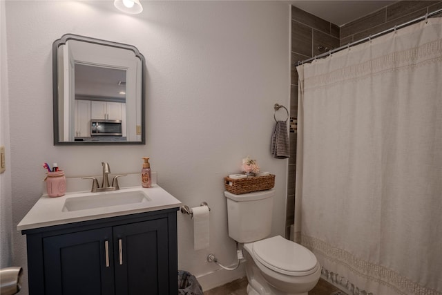 bathroom with vanity, toilet, and a shower with shower curtain