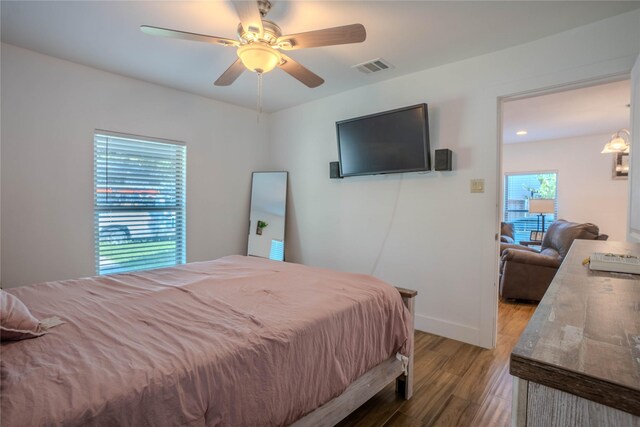 bedroom featuring hardwood / wood-style flooring and ceiling fan