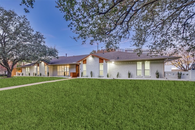 view of front of property with a lawn