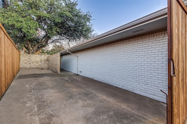 view of side of property with a patio