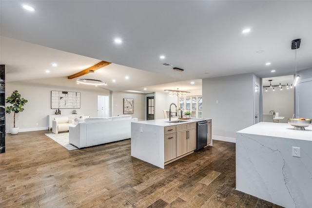 kitchen with dishwasher, an island with sink, decorative light fixtures, and sink