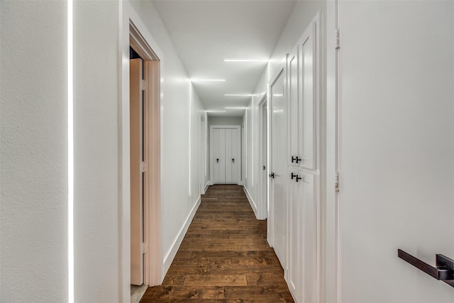 corridor featuring dark hardwood / wood-style flooring