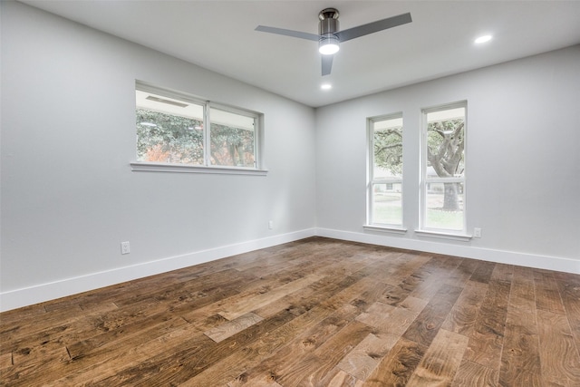 empty room with wood-type flooring and ceiling fan