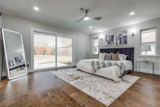 bedroom featuring access to exterior, ceiling fan, and dark wood-type flooring