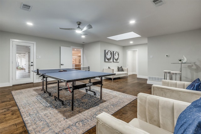 rec room with ceiling fan and dark hardwood / wood-style flooring