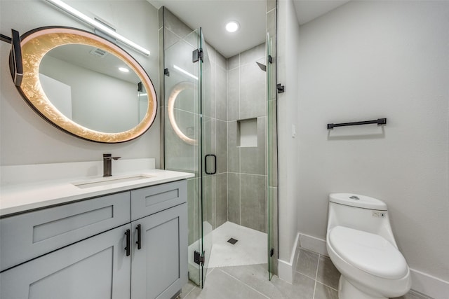 bathroom featuring tile patterned floors, vanity, toilet, and an enclosed shower