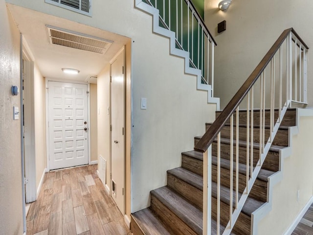 stairway featuring hardwood / wood-style floors