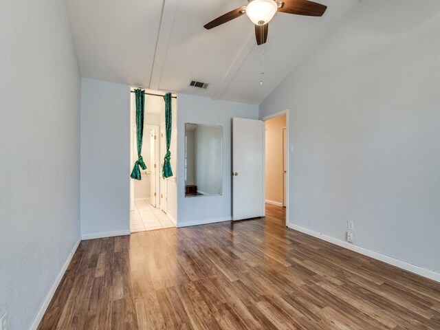 living room featuring wood-type flooring, a brick fireplace, high vaulted ceiling, and ceiling fan