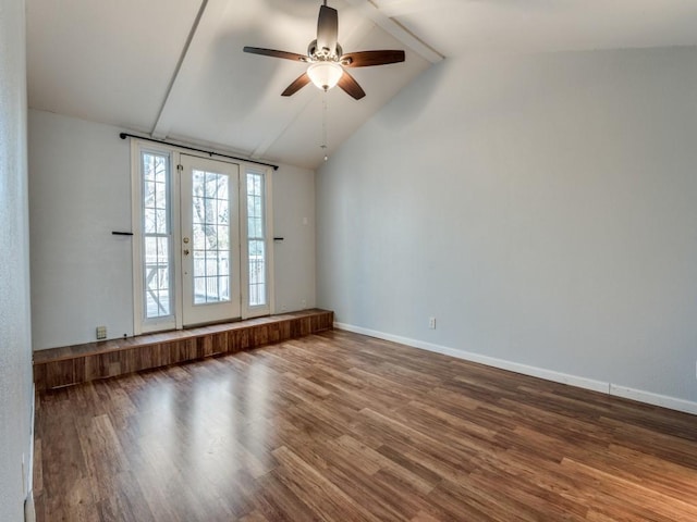 spare room featuring ceiling fan, lofted ceiling, and hardwood / wood-style flooring