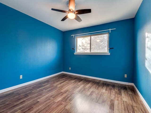 unfurnished room featuring hardwood / wood-style floors and ceiling fan