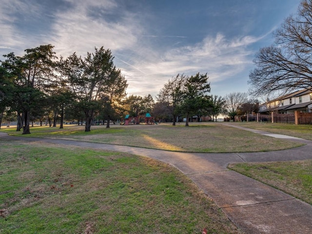 surrounding community featuring a yard and a playground