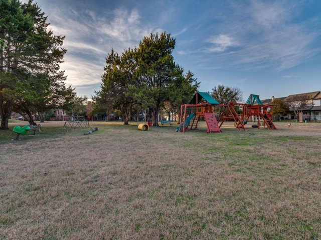 view of playground with a lawn