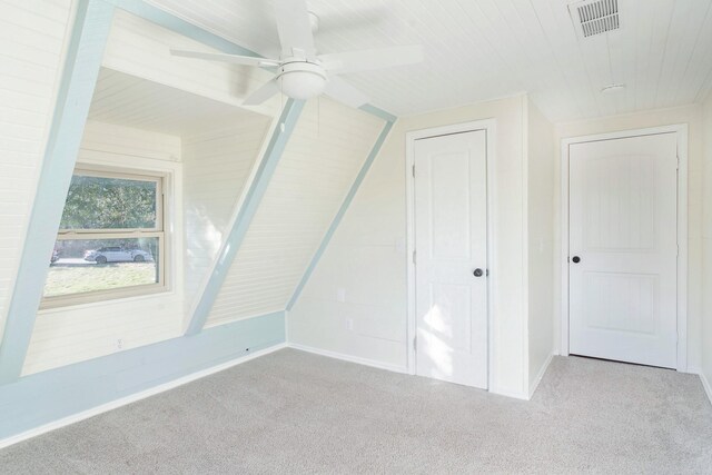 bonus room with lofted ceiling, ceiling fan, and light carpet