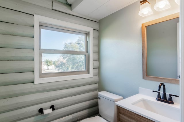 bathroom featuring toilet and vanity