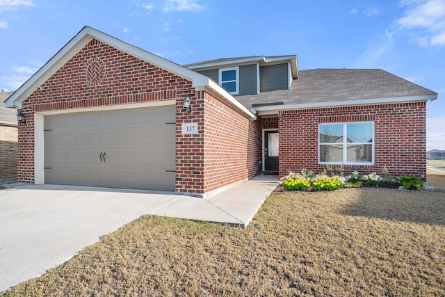 view of front facade featuring a garage and a front yard