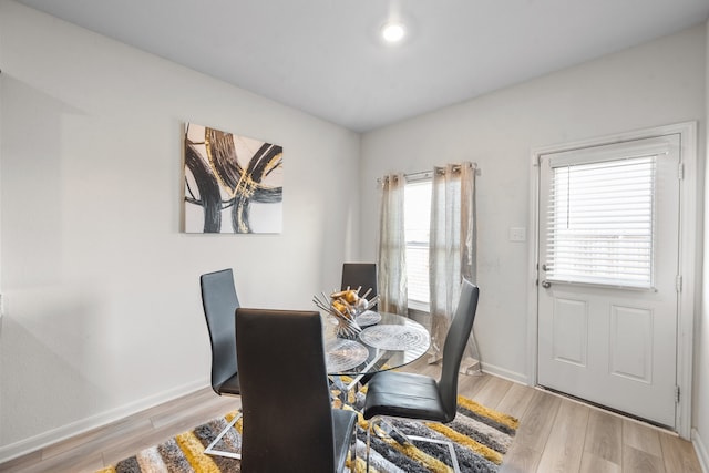 dining room with light wood-type flooring