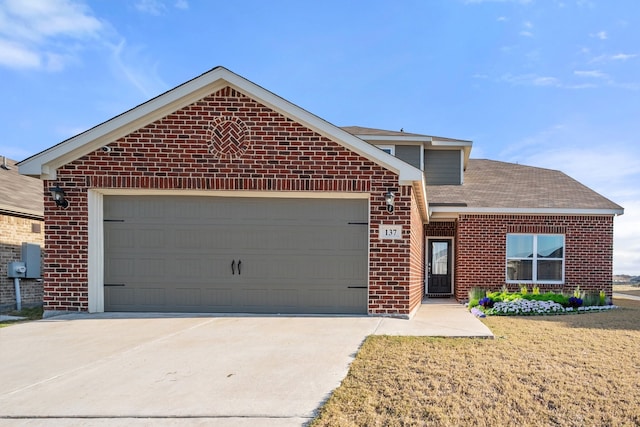 view of front property with a garage and a front yard