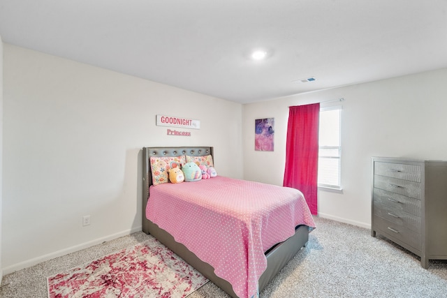 bedroom featuring light carpet