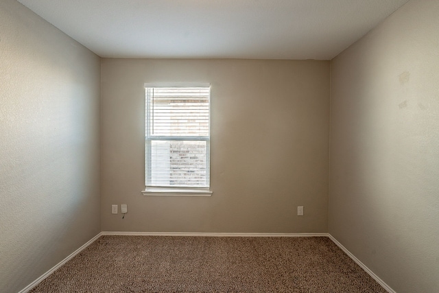 empty room with carpet flooring