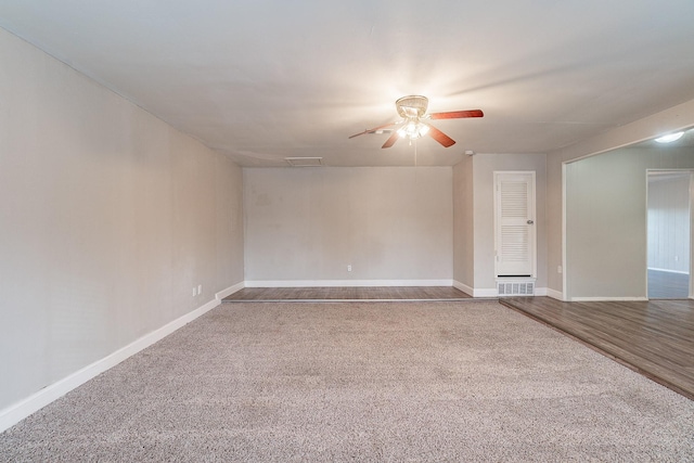 carpeted spare room featuring ceiling fan