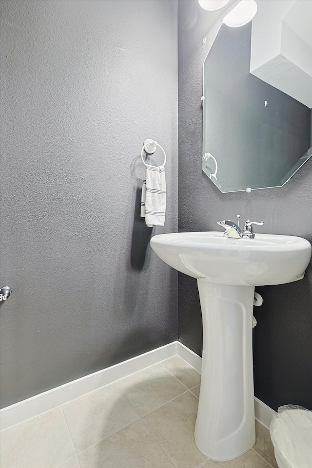 bathroom featuring tile patterned flooring and sink