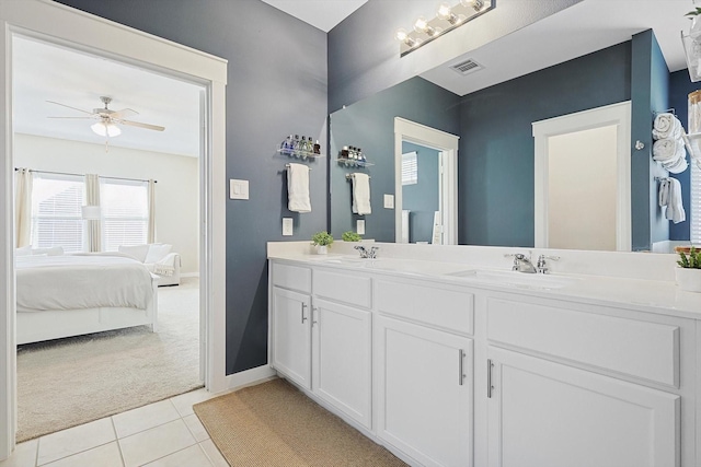 bathroom with ceiling fan, tile patterned flooring, and vanity