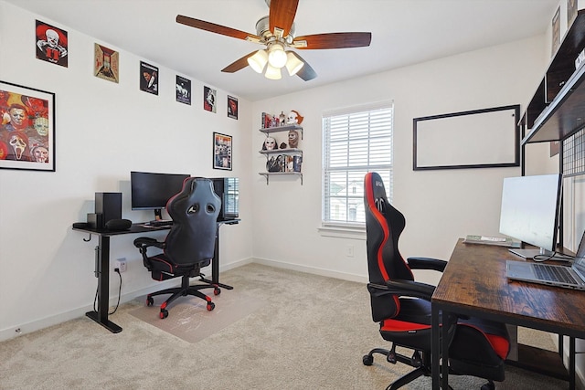 carpeted office space with ceiling fan