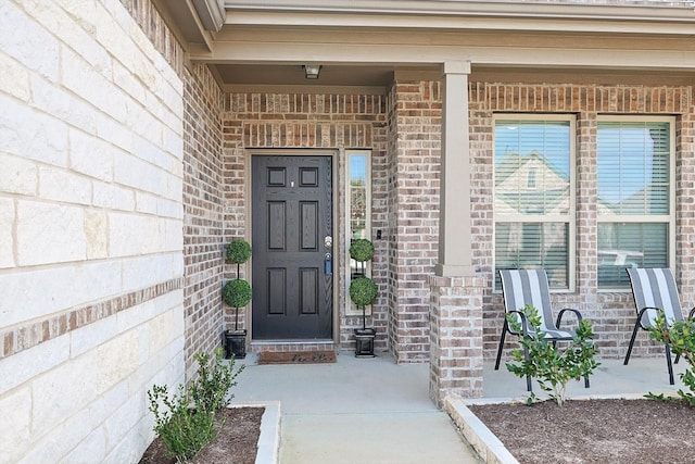 doorway to property with a porch