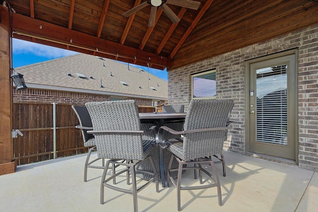 view of patio featuring an outdoor bar and ceiling fan