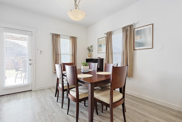 dining room with light wood-type flooring