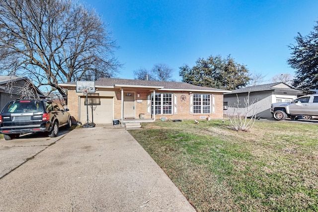 ranch-style house featuring a garage and a front yard