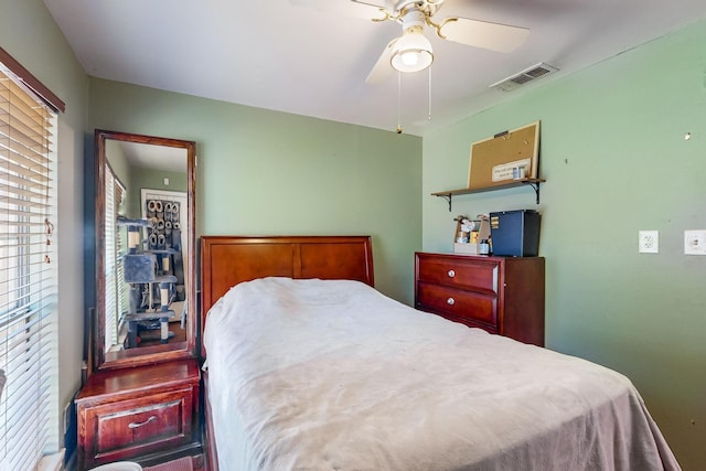 bedroom with multiple windows and ceiling fan